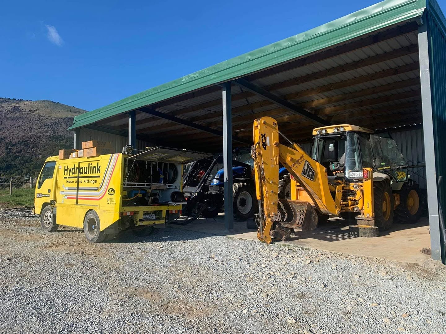 Heavy diesel truck and digger at the workshop